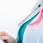 Woman doctor examining scan with pink ribbon 2026 09 24 07 24 37 utc 1